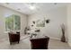 Bright home office with a window and modern desk with comfortable seating at 794 W Leatherwood Ave, Queen Creek, AZ 85140