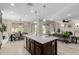 Open concept kitchen island, breakfast area, and bright living room with tile flooring at 794 W Leatherwood Ave, Queen Creek, AZ 85140