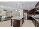 Open concept featuring spacious kitchen island, breakfast area, and bright living room at 794 W Leatherwood Ave, Queen Creek, AZ 85140