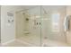 Luxurious walk-in shower with glass enclosure, modern fixtures, and built-in bench at 794 W Leatherwood Ave, Queen Creek, AZ 85140