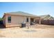 Backyard with desert landscaping and covered patio, perfect for outdoor living at 9025 W Crown King Rd, Tolleson, AZ 85353
