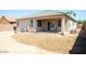 Backyard with desert landscaping and covered patio at 9025 W Crown King Rd, Tolleson, AZ 85353