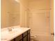 Bathroom featuring vanity with sink and a shower-tub combination at 9025 W Crown King Rd, Tolleson, AZ 85353
