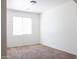 Clean bedroom featuring a window with blinds, neutral carpet, and freshly painted walls at 9025 W Crown King Rd, Tolleson, AZ 85353