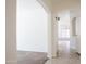 Bright entryway showcasing neutral tile flooring and archways leading to the living spaces at 9025 W Crown King Rd, Tolleson, AZ 85353