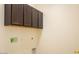 Functional laundry room with storage cabinets at 9025 W Crown King Rd, Tolleson, AZ 85353