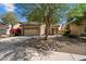 Charming two-story home with a well-maintained front yard and two-car garage at 973 E Corral St, Avondale, AZ 85323