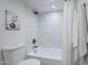Bathroom showcasing a shower-over-tub combination with white subway tile and sleek fixtures and white curtain at 1021 S Almar Cir, Mesa, AZ 85204