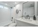 Modern bathroom features a sleek vanity, contemporary fixtures, and a shower-tub combination at 1021 S Almar Cir, Mesa, AZ 85204