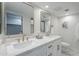 Bathroom featuring double sinks, gold-toned fixtures, and a modern vanity with ample counter space at 1021 S Almar Cir, Mesa, AZ 85204