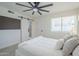 Bedroom featuring a large bed with nightstands and a window with blinds, offering both comfort and privacy at 1021 S Almar Cir, Mesa, AZ 85204
