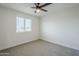 This bedroom has neutral walls, carpet and a window with light filtering blinds at 1021 S Almar Cir, Mesa, AZ 85204