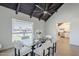 Dining area featuring an open, airy design with natural light, wood flooring, and modern ceiling at 1021 S Almar Cir, Mesa, AZ 85204