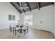 Dining area featuring an open, airy design with natural light and wood flooring at 1021 S Almar Cir, Mesa, AZ 85204