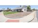 Property featuring rock landscaping and a well-maintained lawn at 1021 S Almar Cir, Mesa, AZ 85204