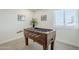 A well-lit game room featuring a foosball table, decorative art, and bright windows at 1021 S Almar Cir, Mesa, AZ 85204
