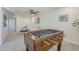 Spacious game room features a foosball table, a cozy seating area and a ceiling fan at 1021 S Almar Cir, Mesa, AZ 85204