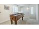 Bright game room with a foosball table, large windows, and ample natural light at 1021 S Almar Cir, Mesa, AZ 85204