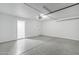This spacious garage has an epoxy floor, garage door opener and access door at 1021 S Almar Cir, Mesa, AZ 85204