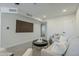 Modern living room boasts a large television, neutral decor, and comfortable seating for relaxation at 1021 S Almar Cir, Mesa, AZ 85204