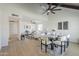 Bright, open-concept living room and dining area with light wood floors at 1021 S Almar Cir, Mesa, AZ 85204