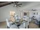 Bright, open-concept living room and dining area with light wood floors and modern fixtures at 1021 S Almar Cir, Mesa, AZ 85204