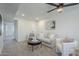 Bright living room features neutral tones, modern furnishings, and recessed lighting for a cozy ambiance at 1021 S Almar Cir, Mesa, AZ 85204