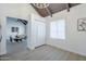 Versatile living area featuring wood floors, a closet and natural light from the window at 1021 S Almar Cir, Mesa, AZ 85204