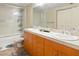 Bright bathroom features a shower over tub and double sinks with lots of vanity storage at 114 W Adams St # 505, Phoenix, AZ 85003