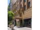 Elegant building entrance featuring architectural details, planters and awning at 114 W Adams St # 505, Phoenix, AZ 85003