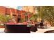 Serene outdoor courtyard featuring stylish lounge seating, barbecue grill, and lush tropical plants for relaxation at 114 W Adams St # 505, Phoenix, AZ 85003