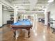 Spacious game room featuring a pool table, seating areas, and ample recreational space at 114 W Adams St # 505, Phoenix, AZ 85003
