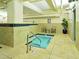Indoor hot tub with seating and tiled deck, conveniently located next to the indoor pool at 114 W Adams St # 505, Phoenix, AZ 85003