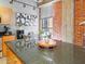 Stylish kitchen with a sleek island, modern appliances, and exposed brick accent wall at 114 W Adams St # 505, Phoenix, AZ 85003