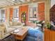 Bright living room with red brick wall, neutral furniture and large windows for natural light at 114 W Adams St # 505, Phoenix, AZ 85003
