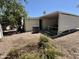 View of the home's backyard with gravel landscaping and a well-maintained exterior at 120 N Val Vista Dr # 272, Mesa, AZ 85213