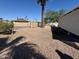 A private backyard area with gravel covering, shaded by a mature palm tree at 120 N Val Vista Dr # 272, Mesa, AZ 85213
