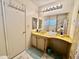 Bathroom with a built in vanity, a sink, large mirror, and a stand up shower visible in the mirror at 120 N Val Vista Dr # 272, Mesa, AZ 85213