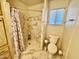 Bathroom featuring stand up shower with white marble tile surround, and a low flow toilet at 120 N Val Vista Dr # 272, Mesa, AZ 85213