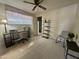 Bedroom with a desk, office chair, additional shelving, and an accent chair with a plant at 120 N Val Vista Dr # 272, Mesa, AZ 85213