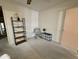 Bedroom with an accent chair, shelving with decor, and a small drawer unit at 120 N Val Vista Dr # 272, Mesa, AZ 85213