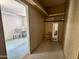 Walk in closet with a small seat and mirror, as well as wood paneling at 120 N Val Vista Dr # 272, Mesa, AZ 85213