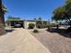 Single story home with covered parking, landscaped yard, and desert rock at 120 N Val Vista Dr # 272, Mesa, AZ 85213