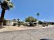 Charming manufactured home with a well-maintained yard and mature landscaping at 120 N Val Vista Dr # 272, Mesa, AZ 85213