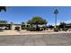 Charming manufactured home with a well-maintained yard and mature landscaping at 120 N Val Vista Dr # 272, Mesa, AZ 85213