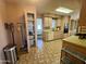 Functional kitchen offering plenty of storage cabinets and view into adjacent room at 120 N Val Vista Dr # 272, Mesa, AZ 85213