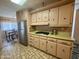 Kitchen features stainless steel appliances, gas range, and adjacent dining area at 120 N Val Vista Dr # 272, Mesa, AZ 85213