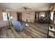 Open-concept living room featuring laminate flooring, natural light, and neutral color at 120 N Val Vista Dr # 272, Mesa, AZ 85213