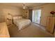 Inviting bedroom with outdoor access, ceiling fan, carpeted floor, dresser and natural light at 120 N Val Vista Dr # 272, Mesa, AZ 85213