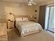 Well-lit main bedroom features a sliding door to the exterior and stylish decor at 120 N Val Vista Dr # 272, Mesa, AZ 85213